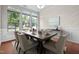 Dining room featuring hardwood floors, a large window, and dining set at 850 Apalachia Lake Dr, Fuquay Varina, NC 27526