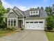Charming home with a gray exterior, well-kept lawn, and two-car garage at 850 Apalachia Lake Dr, Fuquay Varina, NC 27526