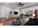Comfortable living room showcases stylish decor, an area rug, hardwood floors, and seamless access to the kitchen at 850 Apalachia Lake Dr, Fuquay Varina, NC 27526