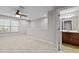 Bright living room featuring a large window for natural light and easy access to the ensuite bathroom at 850 Apalachia Lake Dr, Fuquay Varina, NC 27526