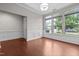 Bright and airy room with wainscoting, hardwood floors, and multiple windows at 850 Apalachia Lake Dr, Fuquay Varina, NC 27526