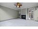 Covered patio featuring a fireplace, providing an ideal space for year-round outdoor enjoyment and relaxation at 850 Apalachia Lake Dr, Fuquay Varina, NC 27526