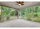 Spacious screened-in porch with views of lush greenery, perfect for outdoor living and entertaining at 850 Apalachia Lake Dr, Fuquay Varina, NC 27526
