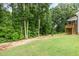 Spacious backyard featuring a tiered deck and lush green lawn, perfect for outdoor enjoyment at 90 Starwood Dr, Garner, NC 27529