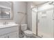 A bathroom showcases a glass-doored shower and white sink with modern fixtures at 90 Starwood Dr, Garner, NC 27529