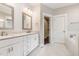 Elegant bathroom with double vanity, granite countertops, and walk-in closet at 90 Starwood Dr, Garner, NC 27529