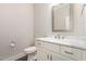 A bathroom features a modern vanity with a white marble countertop and wood floors at 90 Starwood Dr, Garner, NC 27529