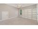 This bedroom features an empty built-in bookcase with carpet floors and natural light at 90 Starwood Dr, Garner, NC 27529