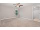 This bedroom features neutral walls, carpet floors, and natural light from a window at 90 Starwood Dr, Garner, NC 27529