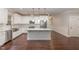 Modern white kitchen features stainless steel appliances and a center island at 90 Starwood Dr, Garner, NC 27529