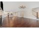 Open floor plan with hardwood floors seamlessly connects the living room and kitchen at 90 Starwood Dr, Garner, NC 27529