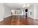 Bright living room with hardwood floors, fireplace, and access to the backyard at 90 Starwood Dr, Garner, NC 27529