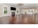 Open floor plan with fireplace seamlessly connects the living room and kitchen at 90 Starwood Dr, Garner, NC 27529