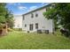 Well-maintained backyard with lush lawn, patio area, and play area perfect for outdoor activities at 925 Spring Meadow Dr, Durham, NC 27713