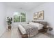 Staged bedroom features an area rug, large window, and modern decor at 925 Spring Meadow Dr, Durham, NC 27713