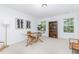 Neutral bedroom features a glass desk with modern decor, carpet, and natural light at 925 Spring Meadow Dr, Durham, NC 27713