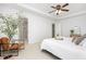 Bright bedroom features neutral tones, ceiling fan, carpet, and an ensuite bathroom with glass shower at 925 Spring Meadow Dr, Durham, NC 27713
