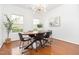 Elegant dining room featuring modern light fixture and plenty of natural light at 925 Spring Meadow Dr, Durham, NC 27713