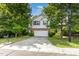 Charming two-story home with well-manicured lawn and inviting curb appeal at 925 Spring Meadow Dr, Durham, NC 27713