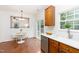 Cozy breakfast nook next to the kitchen featuring lots of natural light and easy access to back yard at 925 Spring Meadow Dr, Durham, NC 27713
