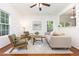 Inviting living area with hardwood floors, comfortable seating, and an abundance of natural light at 925 Spring Meadow Dr, Durham, NC 27713