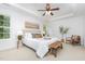 Serene Primary bedroom with tray ceiling, natural light, and a comfortable seating area at 925 Spring Meadow Dr, Durham, NC 27713