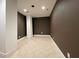 A spacious unfinished basement with ceramic tile flooring and painted columns and walls at 1000 Clovelly Ct, Raleigh, NC 27614