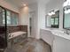 Updated bathroom features tile floors, double vanity, shower/tub combo, and wood blinds at 1000 Clovelly Ct, Raleigh, NC 27614
