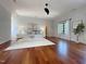 Bright bedroom with hardwood floors, neutral color palette, and an ensuite bath and walk-in closet at 1000 Clovelly Ct, Raleigh, NC 27614