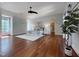 Stylish bedroom with hardwood floors, recessed lighting, and a view to the ensuite bath and walk-in closet at 1000 Clovelly Ct, Raleigh, NC 27614