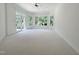 Spacious bonus room with neutral carpet, natural light, perfect for a playroom or entertainment area at 1000 Clovelly Ct, Raleigh, NC 27614