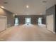 Huge bonus room with dormer windows, neutral walls, and carpet, ready to customize as a playroom or entertainment space at 1000 Clovelly Ct, Raleigh, NC 27614