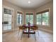 Dining area surrounded by windows providing natural light at 1000 Clovelly Ct, Raleigh, NC 27614