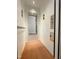 Inside of the home elevator featuring wood flooring, a mirror, and simple elevator controls, adding convenience at 1000 Clovelly Ct, Raleigh, NC 27614