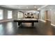 Large open recreational room featuring a pool table and access to the living room at 1000 Clovelly Ct, Raleigh, NC 27614