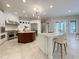 Spacious kitchen featuring two islands, stainless steel appliances, and access to the backyard at 1000 Clovelly Ct, Raleigh, NC 27614
