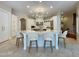 Spacious kitchen features a large island with seating and modern light fixture at 1000 Clovelly Ct, Raleigh, NC 27614