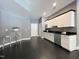 Kitchenette with granite countertops, stainless steel appliances, and white cabinets at 1000 Clovelly Ct, Raleigh, NC 27614