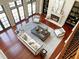 An expansive living room featuring high ceilings, a fireplace, and plenty of natural light at 1000 Clovelly Ct, Raleigh, NC 27614