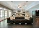 Spacious living room with a fireplace, multiple TV's, and access to other rooms of the house at 1000 Clovelly Ct, Raleigh, NC 27614