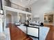 Bright and airy living room with fireplace, high ceilings, and view of second-floor balcony at 1000 Clovelly Ct, Raleigh, NC 27614