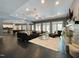 Large living room featuring dark wood floors, a fireplace, modern furniture, and access to an outdoor space at 1000 Clovelly Ct, Raleigh, NC 27614