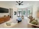 Bright living room features plush seating, modern decor, fireplace, and large windows for ample light at 1000 Clovelly Ct, Raleigh, NC 27614