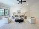 Cozy living room with neutral tones, plush seating, modern accents, and a ceiling fan at 1000 Clovelly Ct, Raleigh, NC 27614