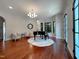 Elegant living room with a grand piano, stylish seating, and arched windows for natural light at 1000 Clovelly Ct, Raleigh, NC 27614