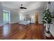 Bright main bedroom features hardwood floors, a ceiling fan, and minimalist decor for a calming space at 1000 Clovelly Ct, Raleigh, NC 27614