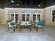 Outdoor patio with comfortable seating, elegant design, and serene backyard views at 1000 Clovelly Ct, Raleigh, NC 27614