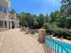Beautiful backyard with a stunning pool area and mature landscaping at 1000 Clovelly Ct, Raleigh, NC 27614