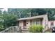 Quaint one-story home with a cozy front porch and mature landscaping at 1002 Loius St, Burlington, NC 27217