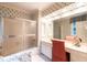 Bathroom featuring a vanity, mirror, and a shower with a sliding glass door at 1002 Vance St, Raleigh, NC 27608